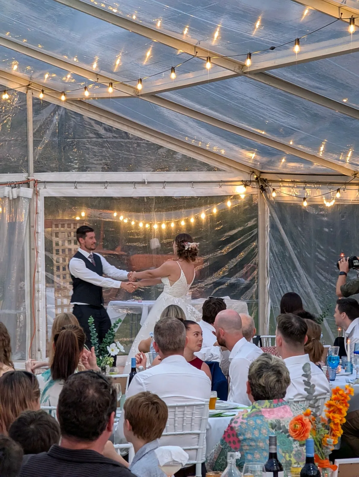 Wedding reception under festoon lighting